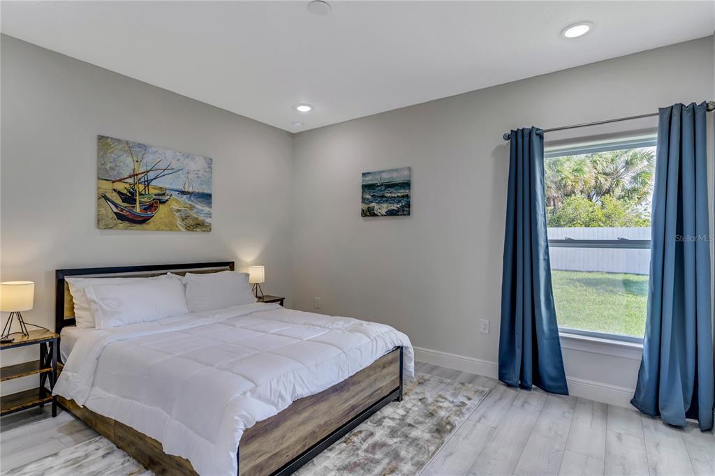 2201 Abalone Boulevard Orlando, FL 32833 - Photo 26 of 32 a bedroom with a bed and a painting on the wall