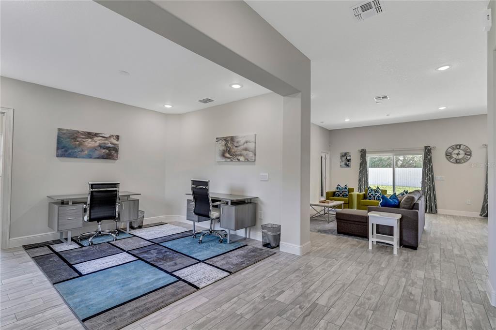 2201 Abalone Boulevard Orlando, FL 32833 - Photo 4 of 32 a living room with furniture rug and wooden floor