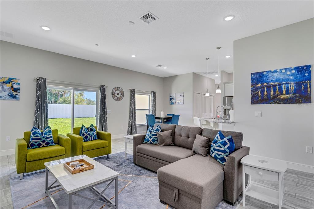 2201 Abalone Boulevard Orlando, FL 32833 - Photo 7 of 32 a living room with furniture and a large window