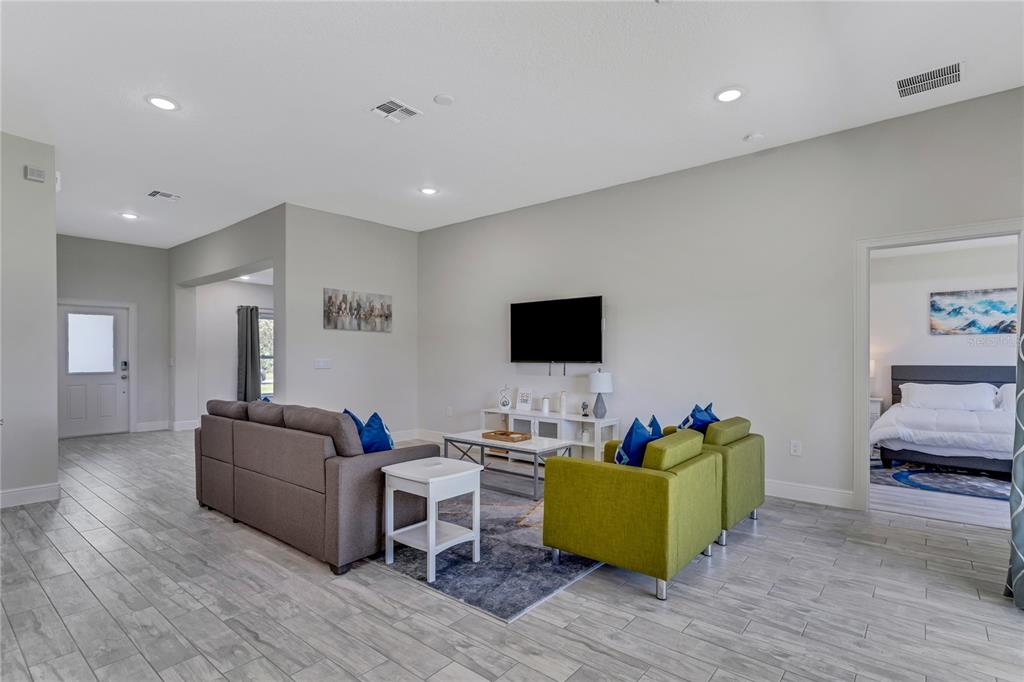 2201 Abalone Boulevard Orlando, FL 32833 - Photo 8 of 32 a living room with furniture and a flat screen tv
