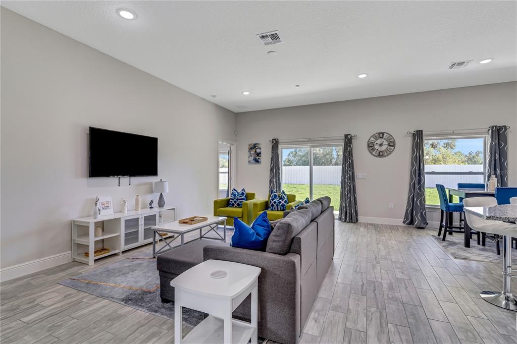 2201 Abalone Boulevard Orlando, FL 32833 - Photo 10 of 32 a living room with furniture and a flat screen tv