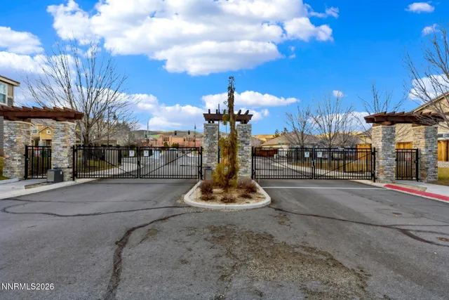 a view of a park with tall buildings