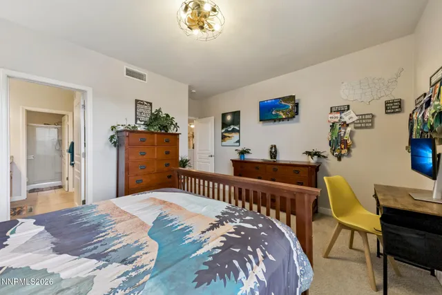 a bedroom with a bed and a table in it