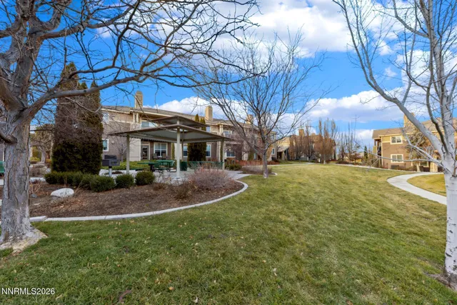 a front view of a building with garden