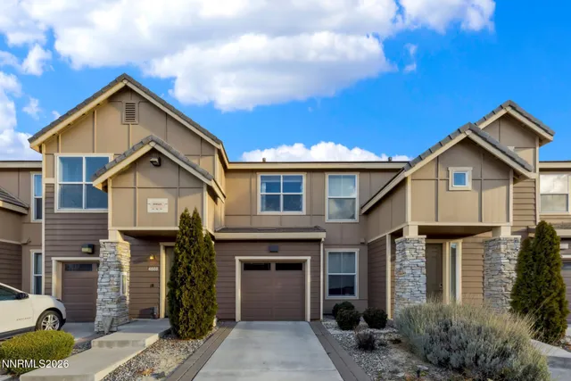 a front view of a house with yard