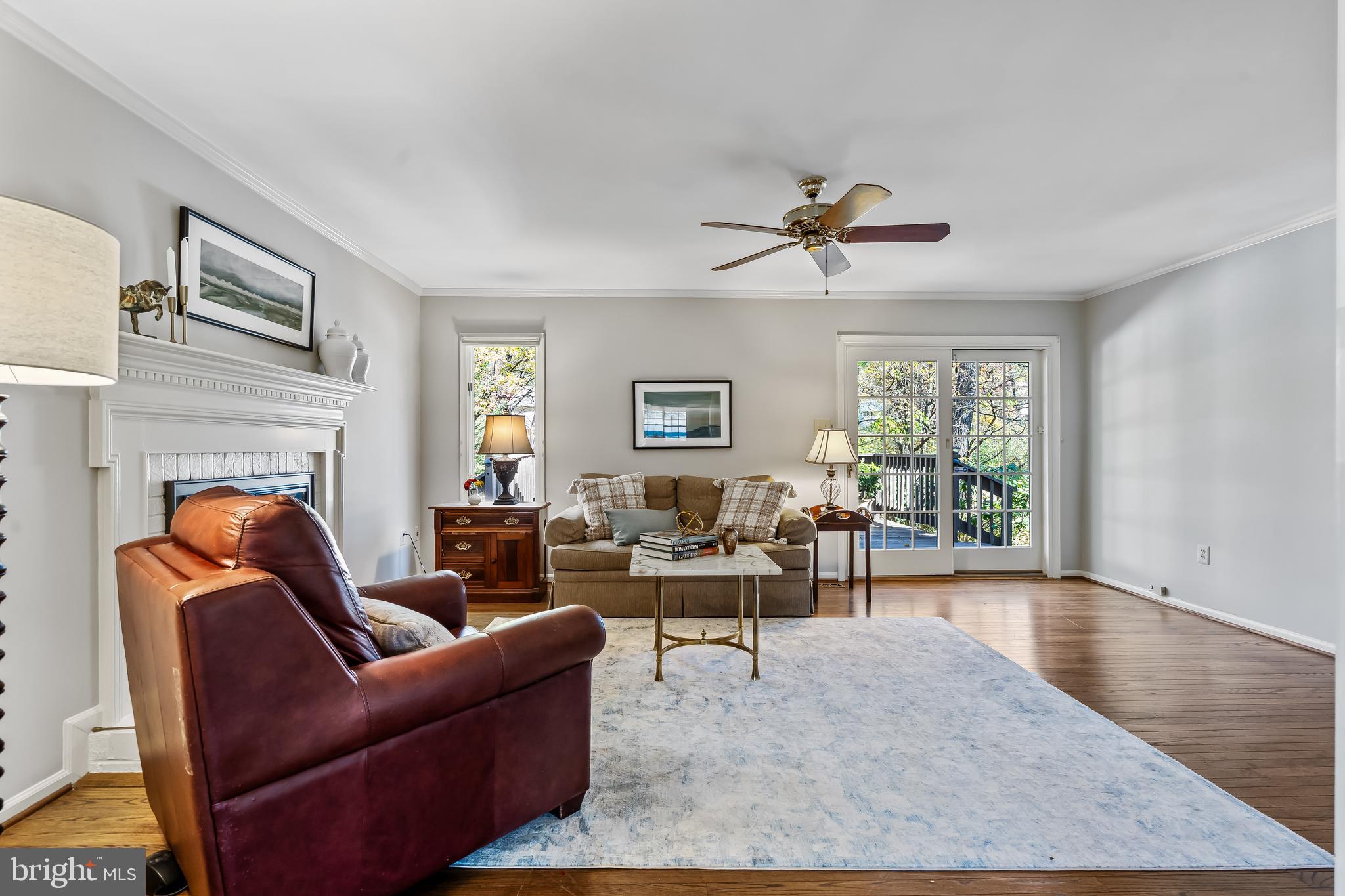 2716 Glencroft Road Vienna, VA 22181 - Photo 13 of 66 a living room with furniture a fireplace and a large window