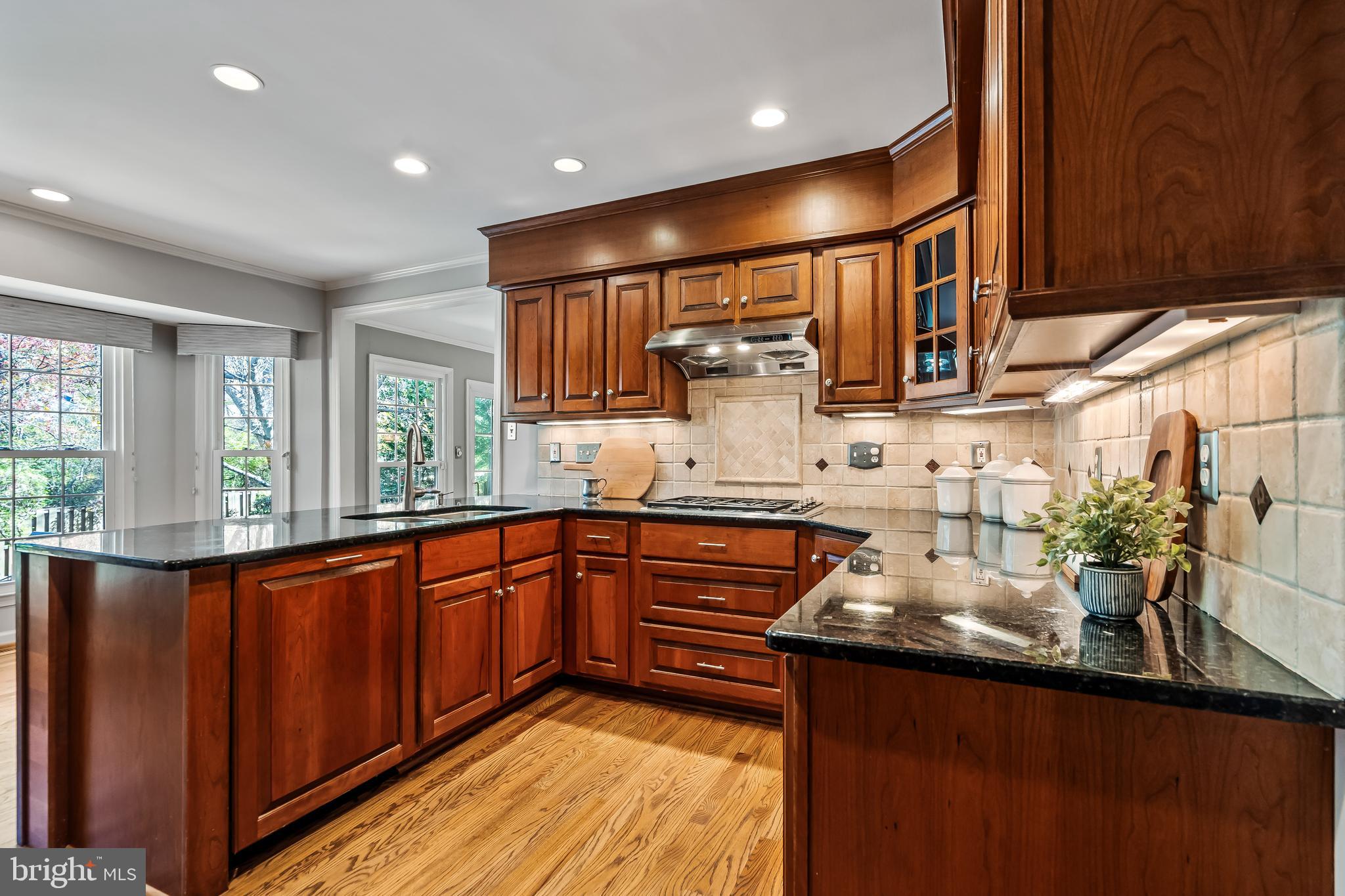 2716 Glencroft Road Vienna, VA 22181 - Photo 19 of 66 a kitchen with stainless steel appliances granite countertop sink stove and cabinets