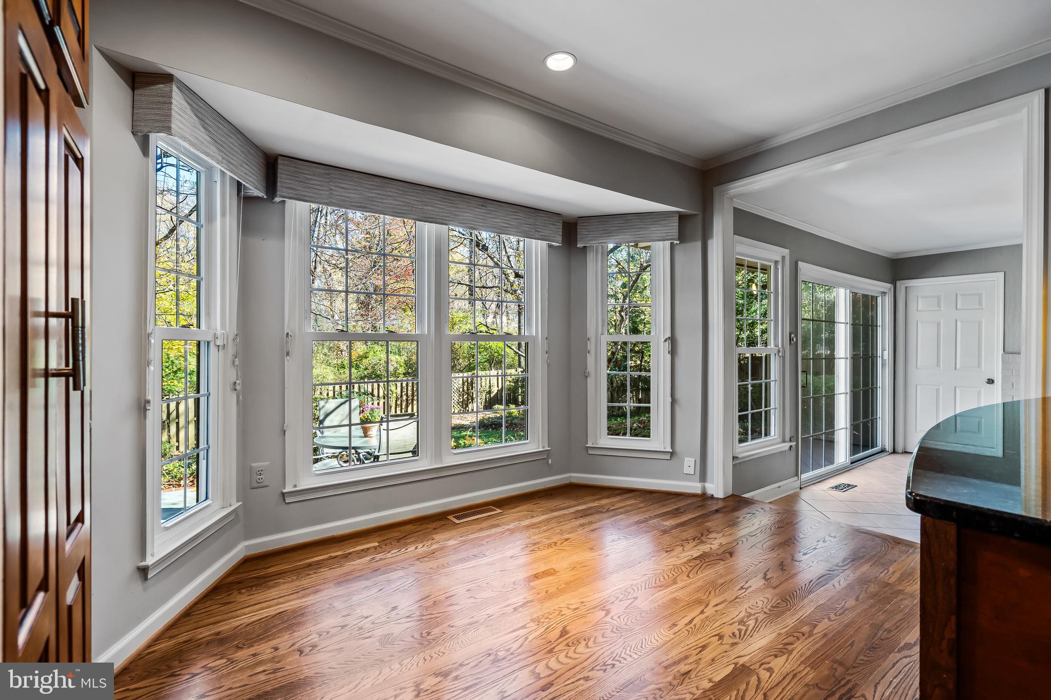 2716 Glencroft Road Vienna, VA 22181 - Photo 24 of 66 a view of an empty room with wooden floor and a window