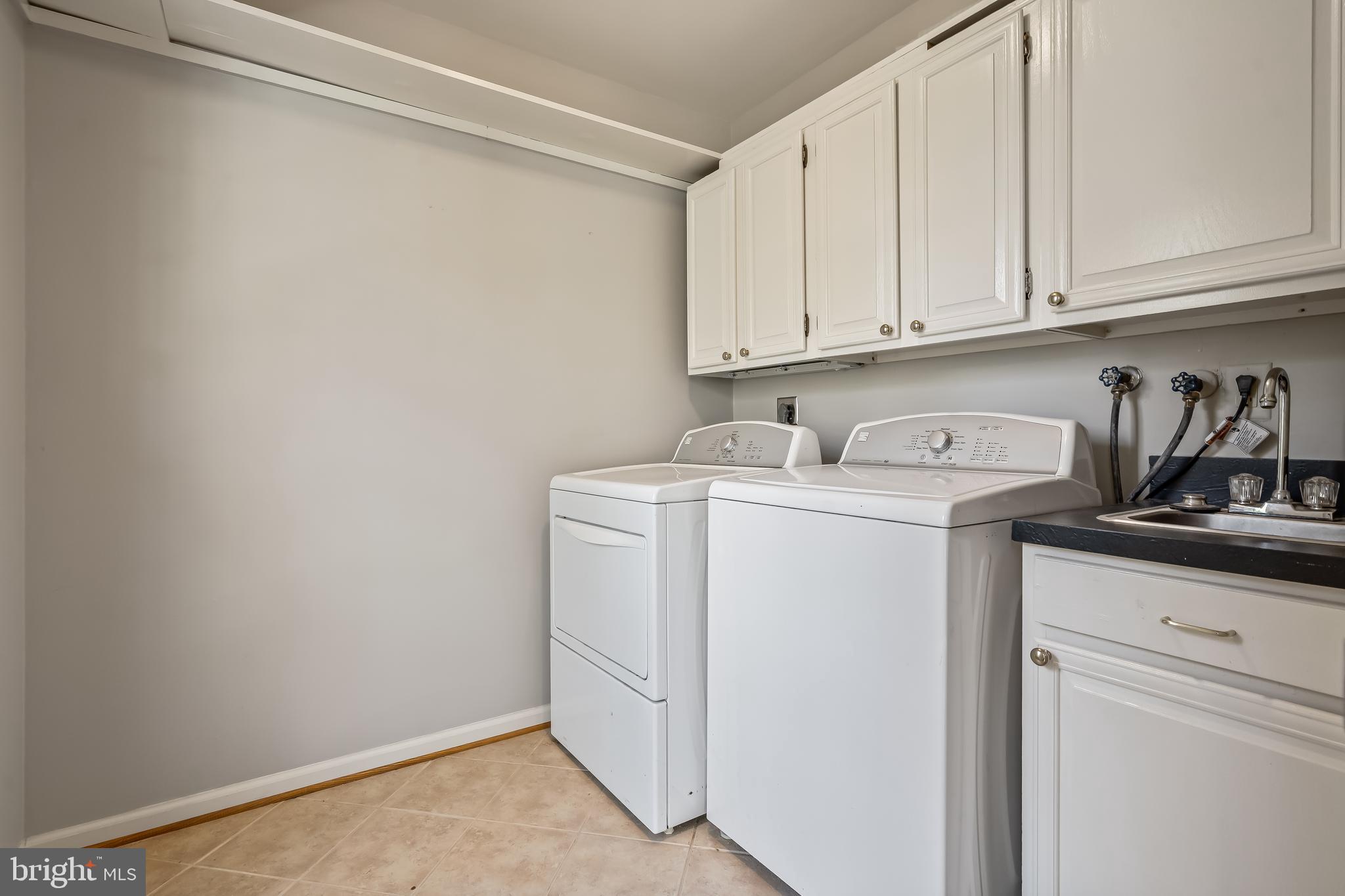 2716 Glencroft Road Vienna, VA 22181 - Photo 26 of 66 a utility room with dryer and washer