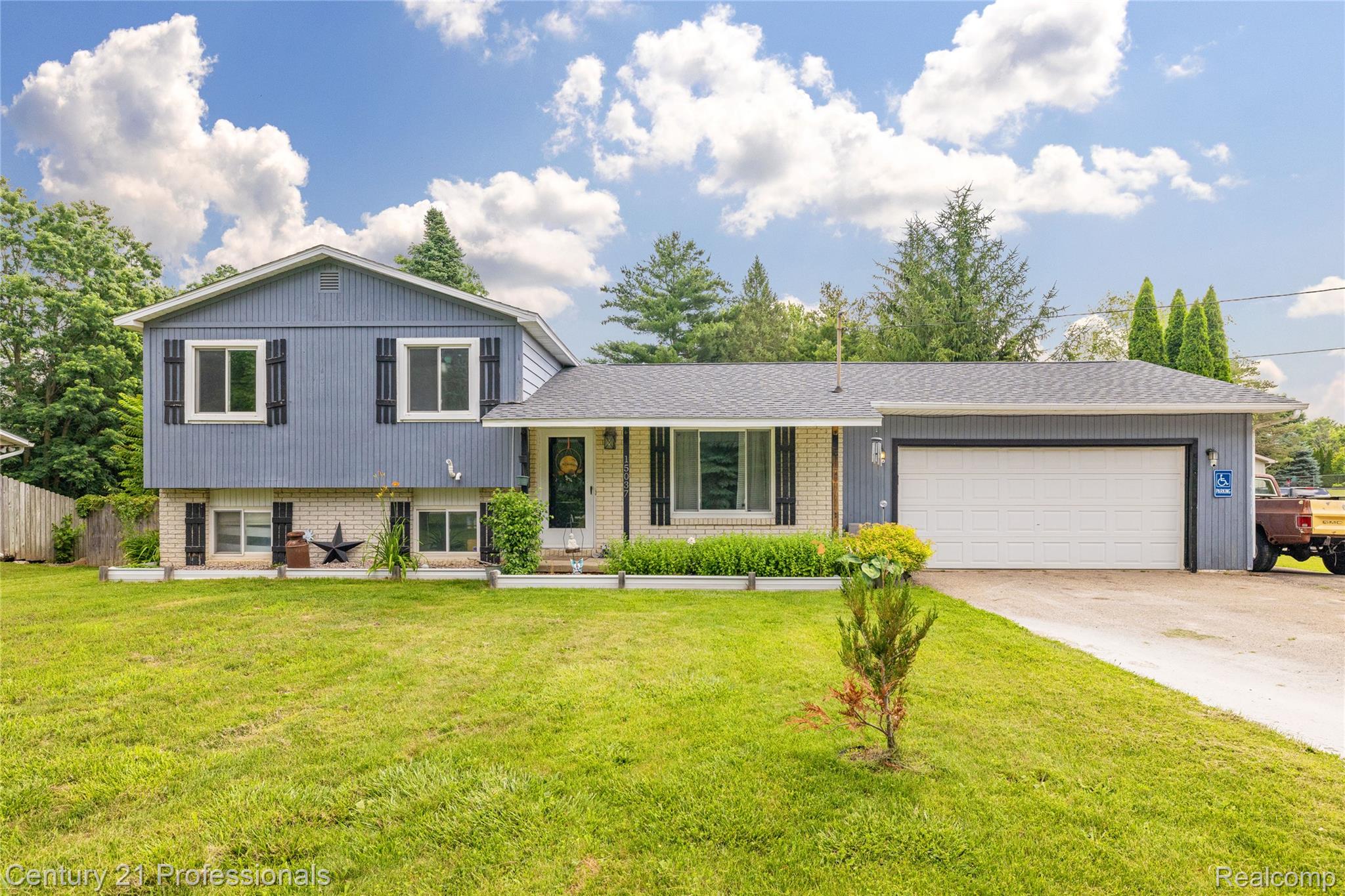 15037 Hogan Road Linden, MI 48451 - Photo 38 of 38 Split-level residence featuring blue siding and a light brick facade
