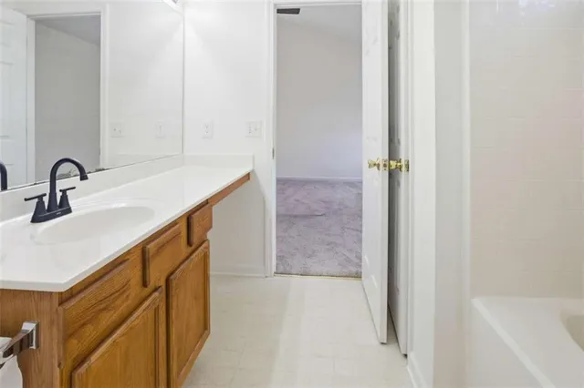 a bathroom with a sink and mirror