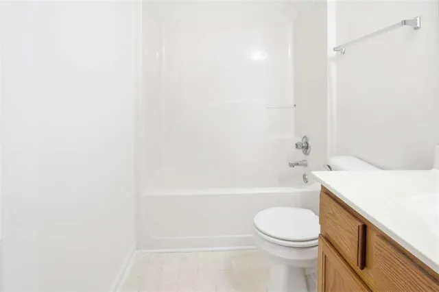 a bathroom with a sink a toilet and a bathtub