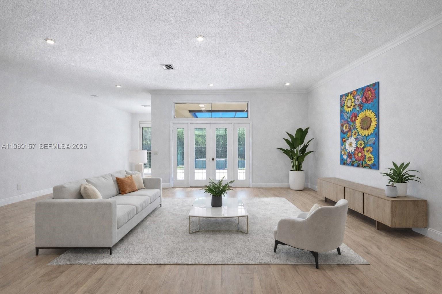 3280 Huntington Weston, FL 33332 - Photo 11 of 64 DIGITALLY ENHANCED to show how the living room can look with white walls, neutral flooring and new doors