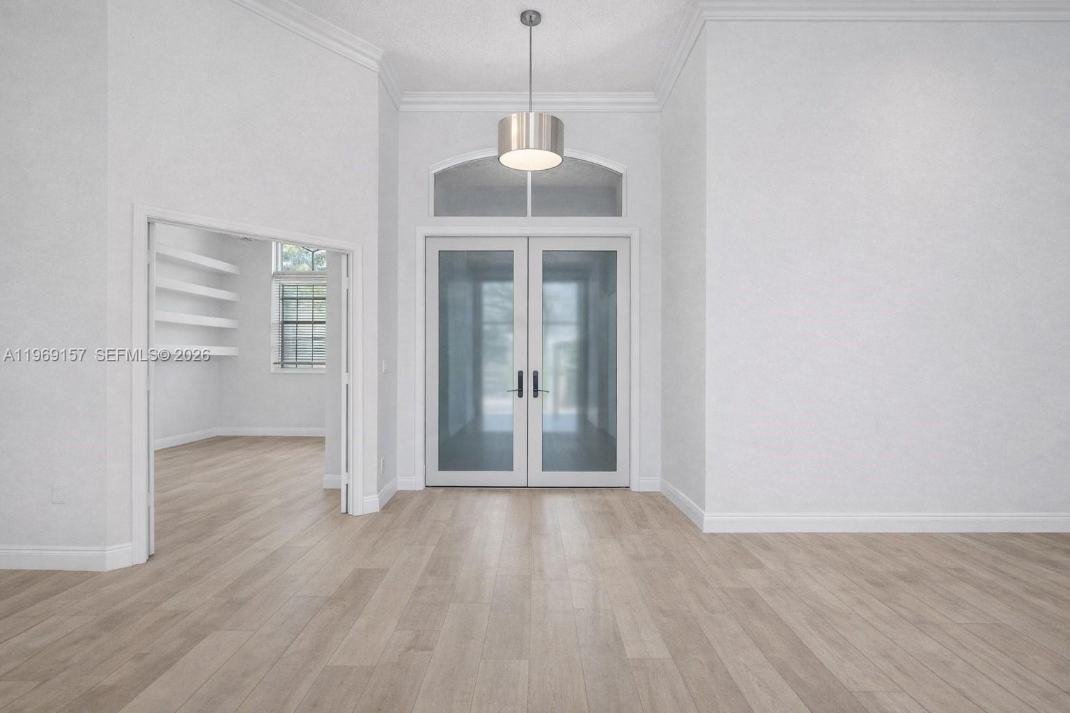 3280 Huntington Weston, FL 33332 - Photo 13 of 64 DIGITALLY ENHANCED to show same view with white walls, neutral flooring & new doors