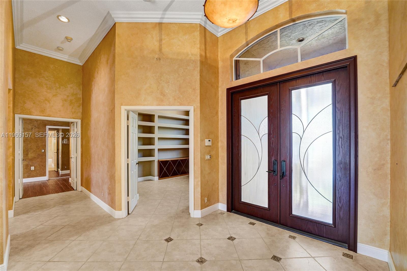 3280 Huntington Weston, FL 33332 - Photo 14 of 64 Entry door with the bedroom/office space immediately to the right and hallway into master bedroom/bathroom