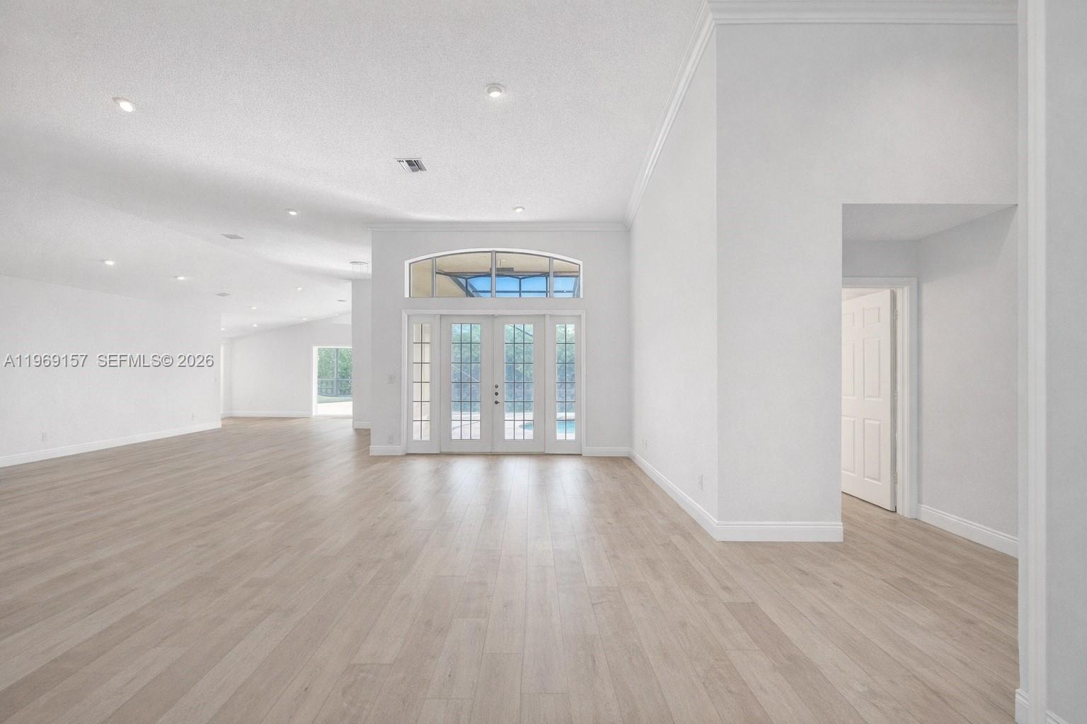 3280 Huntington Weston, FL 33332 - Photo 9 of 64 DIGITALLY ENHANCED to show same view with white walls and neutral flooring