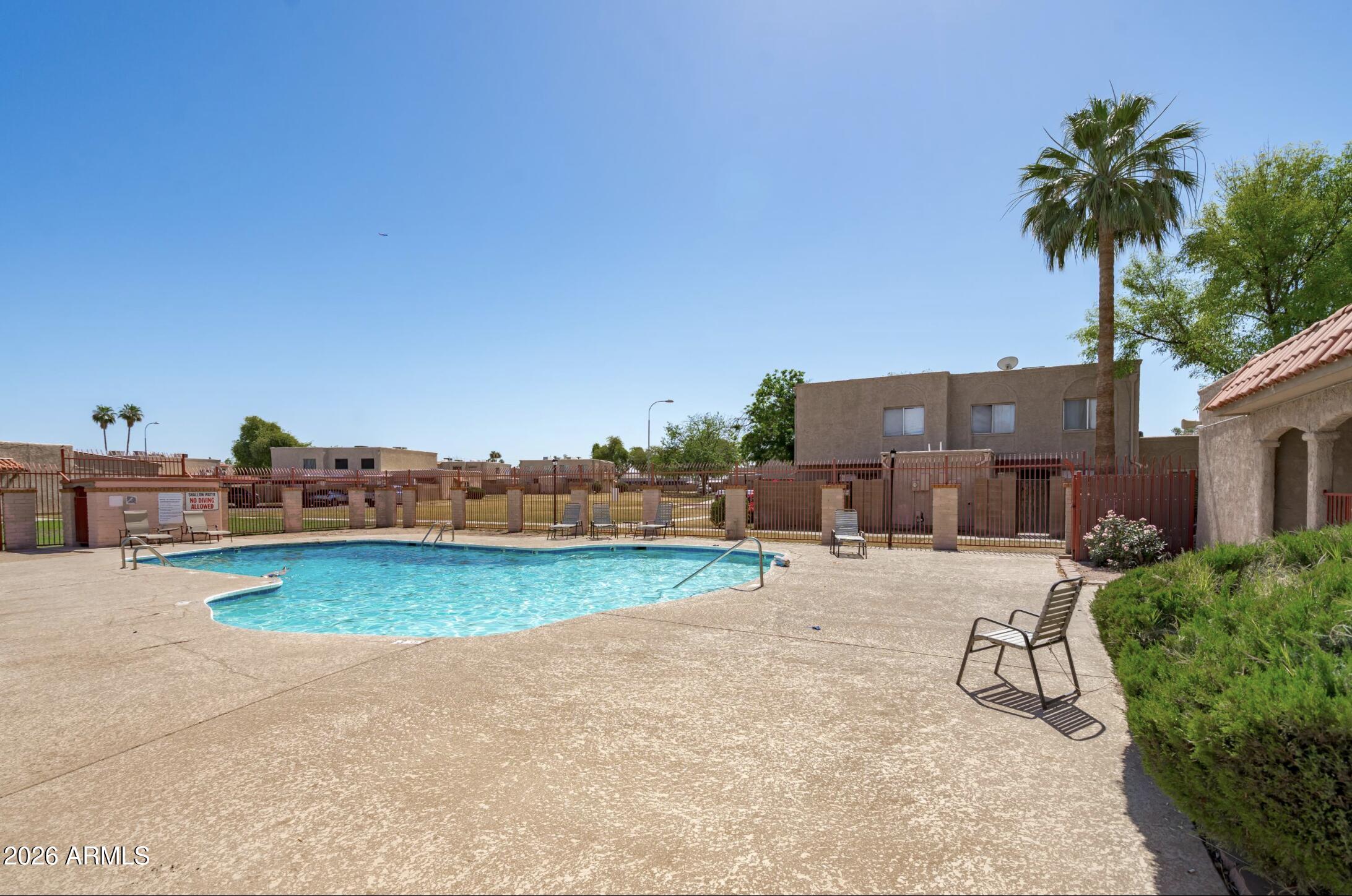 600 South Dobson Road, Unit 88 Mesa, AZ 85202 - Photo 1 of 18 a view of a swimming pool and lounge chair