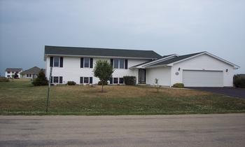 116 Windward Lane Rochelle, IL 61068 - Photo 1 of 1 a front view of a house with a yard