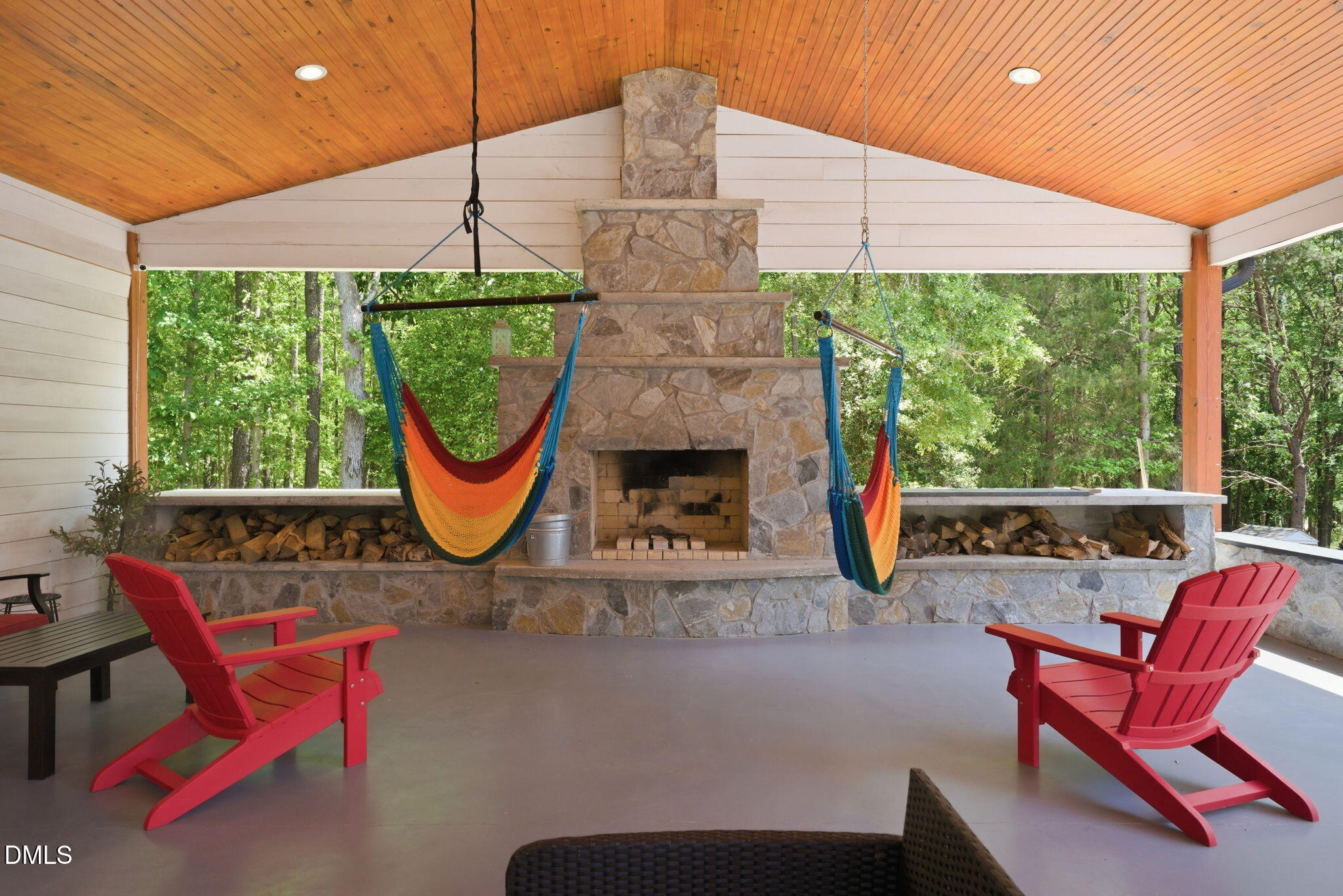 5416 Pulley Town Road Zebulon, NC 27597 - Photo 37 of 74 a living room with furniture a fireplace and a large window