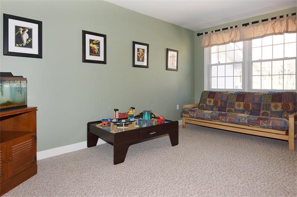 412 George Hill Road Lancaster, MA 01523 - Photo 11 of 26 a living room with furniture and a window