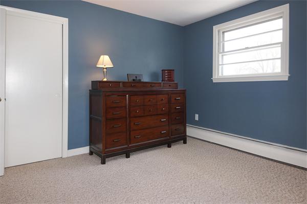 412 George Hill Road Lancaster, MA 01523 - Photo 13 of 26 a room with a dresser and a mirror