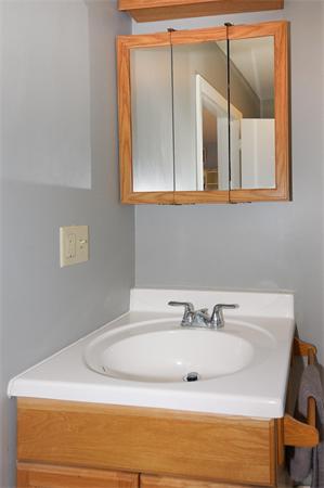 412 George Hill Road Lancaster, MA 01523 - Photo 18 of 26 a bathroom with a sink and a mirror