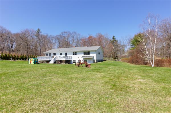 412 George Hill Road Lancaster, MA 01523 - Photo 20 of 26 a utility room with yard and mountain view in back