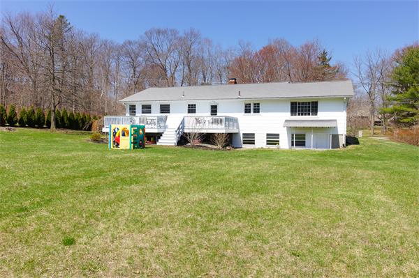 412 George Hill Road Lancaster, MA 01523 - Photo 2 of 26 a front view of house with yard and trees in the background