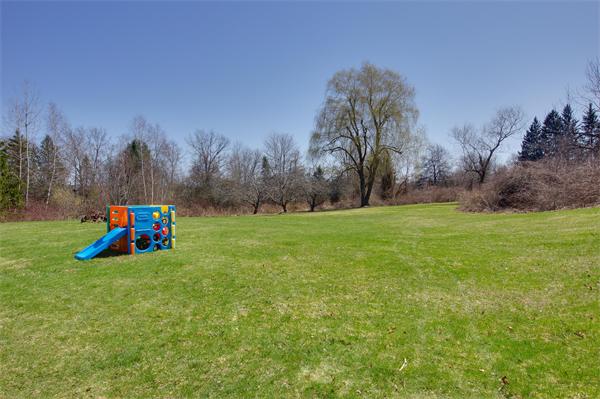 412 George Hill Road Lancaster, MA 01523 - Photo 24 of 26 a house view with a sitting space and garden