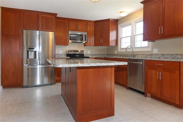 412 George Hill Road Lancaster, MA 01523 - Photo 6 of 26 a kitchen with stainless steel appliances granite countertop a stove a sink dishwasher a refrigerator and a microwave oven