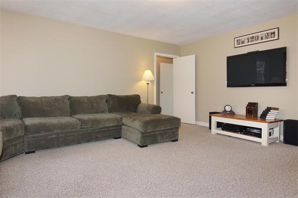 412 George Hill Road Lancaster, MA 01523 - Photo 10 of 26 a living room with furniture and a flat screen tv