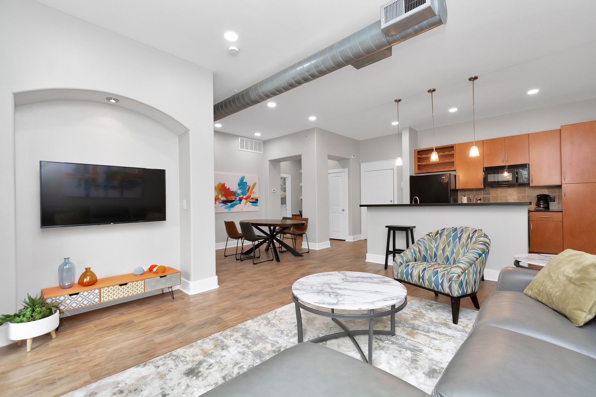 1901 Post Oak Boulevard, Unit 3113 Houston, TX 77056 - Photo 2 of 34 The living room also features an entertainment space for those who want the theater experience at home.