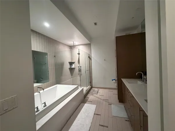 a bathroom with a bathtub and a sink