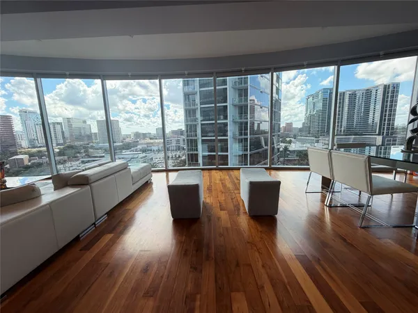 a living room with furniture and a large window