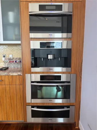 a kitchen with a stove and a microwave