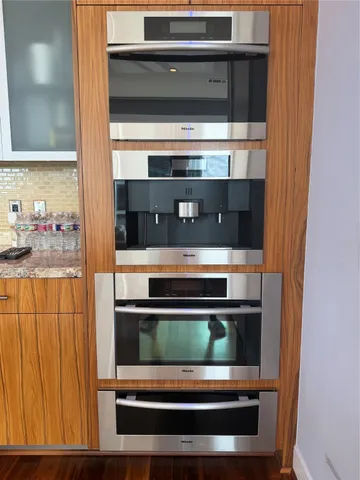 a kitchen with a stove and a microwave