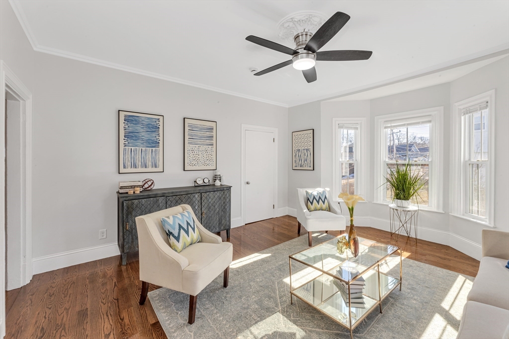419 Poplar Street Boston, MA 02131 - Photo 8 of 27 a living room with furniture and a wooden floor