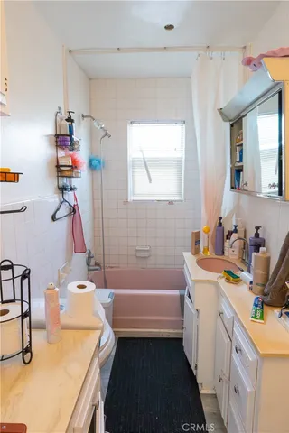 a bedroom with bed and window