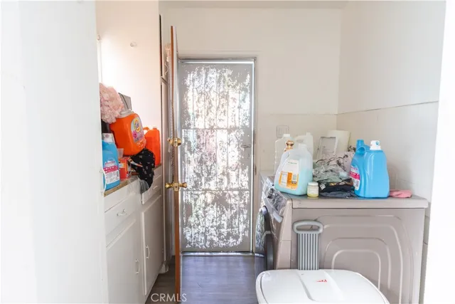 a aerial view of a house with a yard and potted plants