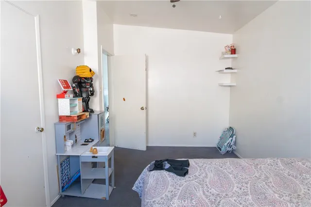 a bathroom with a sink toilet and shower curtain