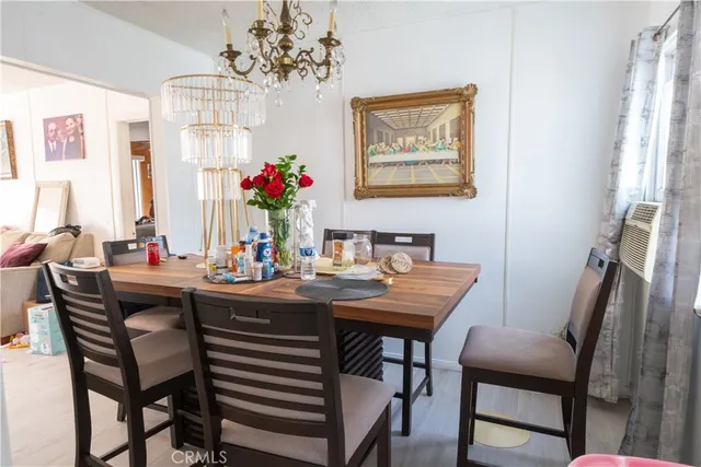 a living room with furniture a window and a flat screen tv