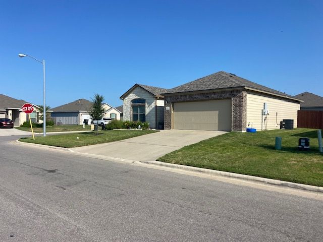 4748 Highmont Drive Temple, TX 76502 - Photo 3 of 12 a front view of a house with a yard and garage