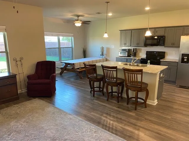a view of a dining room with furniture window and wooden floor