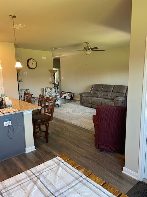 4748 Highmont Drive Temple, TX 76502 - Photo 7 of 12 a living room with couch and a dining table