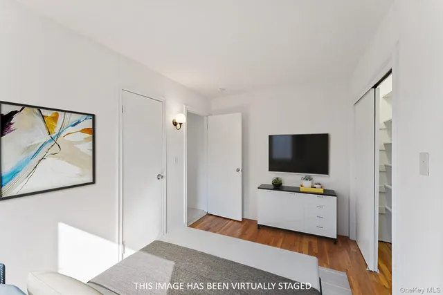 a view of a workspace with furniture and mirror