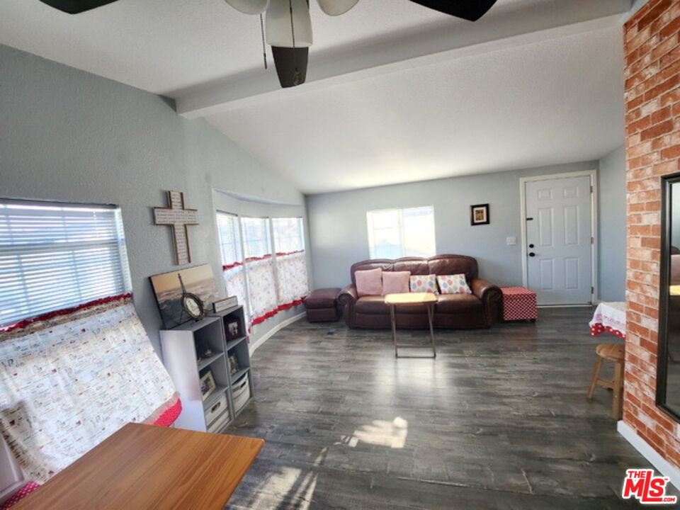 1051 Site Drive, Unit 209 Brea, CA 92821 - Photo 5 of 18 a bedroom with furniture and a wooden floor