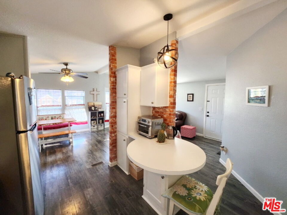 1051 Site Drive, Unit 209 Brea, CA 92821 - Photo 8 of 18 a living room with furniture and a wooden floor
