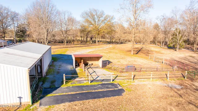 a view of yard covered with snow