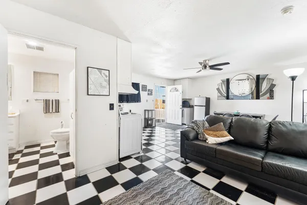 a bedroom with a bed and a cabinet