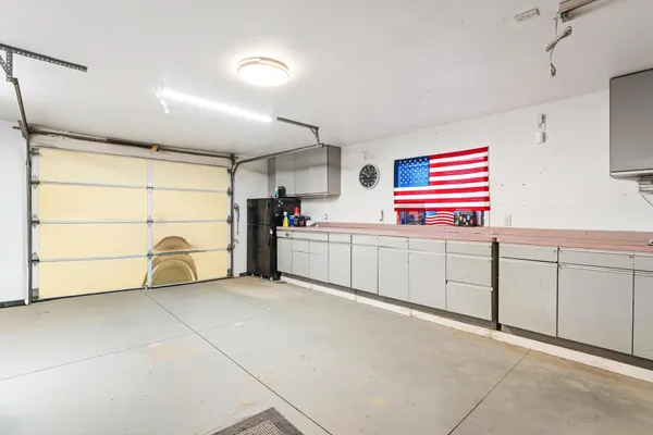 a living room with a black white checkered floor with white walls